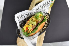 Hot dog sandwich on catering greaseproof paper | LA Streetfood